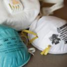 Different types of respirators pictured on a table
